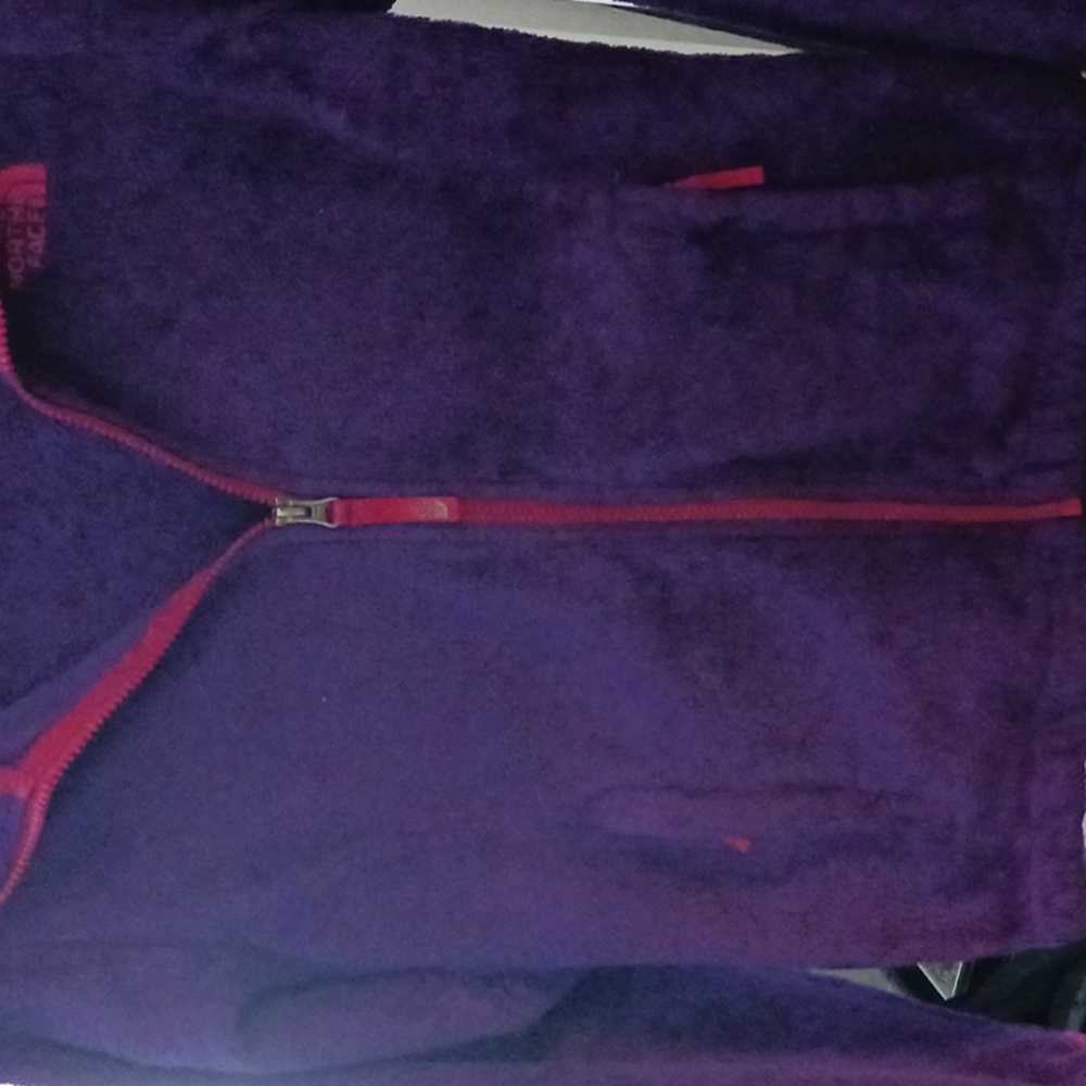 Daughter doesn't want it. It is purple and pink northface jacket that zips up.